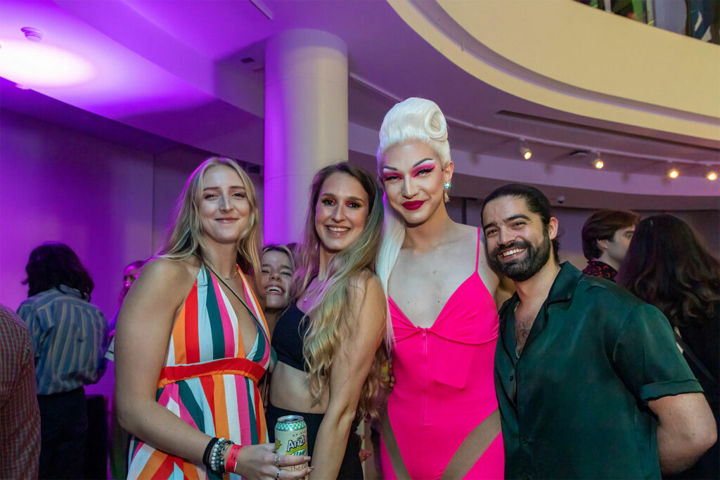 A group of people posing in the museum.